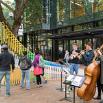Musicians near colorful sculpture